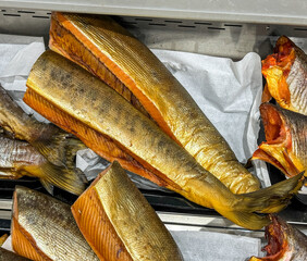 Wall Mural - Close-up of smoked trout in the market