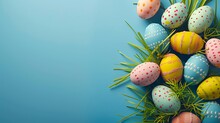 Top view of colorful easter eggs on grass isolated on blue