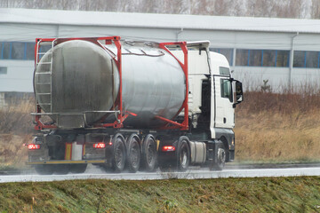 Gas and fuel transportation truck on highway. It ships oil and lpg.