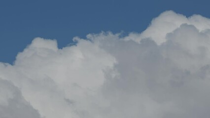 Wall Mural - movement of beautiful clouds in the blue sky, time lapse video. nice nature background for your proj