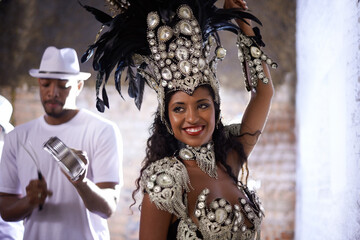 Wall Mural - Woman, band and samba performance at night for celebration in Rio de janeiro for carnival season. Female person, costume and feathers for culture and life, creativity and confidence at festival