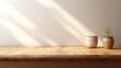 © RM Graphics - Empty minimal natural wooden table counter podium, beautiful wood grain in sunlight, shadow on white wall for luxury cosmetic, skincare, beauty treatment, decoration product display background