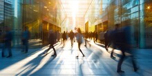 Blurred Motion Of People Walking Briskly In A Modern Urban Environment, Seen Through A Transparent Glass Facade With Reflections And Warm Sunlight.
