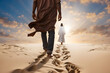 A man walking in the sand following God. Religious theme concept.
