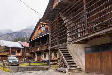 Wall Mural - Traditional wooden houses in the historic mountain village of Cima Sappada in Carnia in Udine Province, Friuli-Venezia Giulia, north east Italy