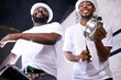 © M Moller/peopleimages.com - Show, drums or happy band in carnival playing an instrument in festival in Rio de Janeiro. Brazil, low angle or group of musicians or artists banging on a drum to create a beat in party performance
