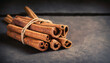 Bunch of cinnamon sticks. vintage photo, dark background, low key shot