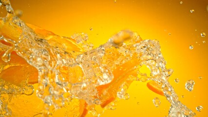 Wall Mural - Freeze Motion of Flying Slices of Oranges with Splashing Water.