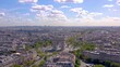 PARIS, FRANCE - MAY 30, 2023: Panorama aerial view of Paris city historical center. Top drone view of old and modern famous touristic landmarks. Colorful sky at at sunny day.