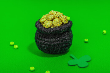 Handmade St. Patrick's Day concept. Traditional decorative symbols, pot with golden coins