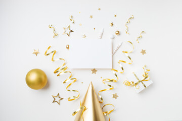 Wall Mural - Golden birthday party template with empty paper card and decoration from gift box, balloons and streamers top view. Festive holiday party invitation.