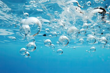 Fototapete - A multitude of bubbles gently float upon the surface of the water, forming a mesmerizing and enchanting display of movement and light reflections