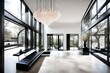 A modern, minimalist vestibule with a high ceiling, an elegant chandelier, and a pair of sleek, black benches