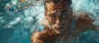 A determined swimmer's face reflects determination and strength as he glides through the crystal clear water of the outdoor pool, his portrait a testament to the beauty and grace of the human form in
