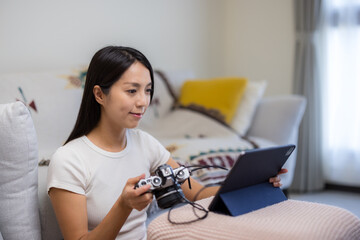 Sticker - Woman use digital camera connect with tablet computer at home