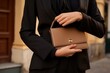 Close up unrecognizable woman holding handbag fashionable lifestyle business stylish businesswoman elegant lady girl female model brand company clothes new collection accessories classic trendy luxury