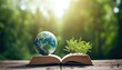 Planet over the open book on a wooden table in nature, green blurry background. World Environment Day. World Mental Health Day concept