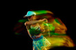 © Lustre Art Group  - Dynamic portrait of female tennis player makes perfect, powerful hit of ball against black studio background. Motion blur effect. Concept of sport, active lifestyles, tournaments, energy, movement.