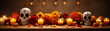 Still life of Mexican sugar skulls, marigolds, candles and fruits on a wooden table.