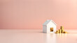 © Jati - Clean Pastel Background. 3D Coins, and Model House. Saving Money, Financial Planning, Home Loan, Real Property, and Capital Investment.