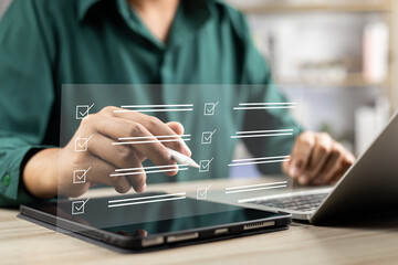 Canvas Print - Digital business performance monitoring survey filling with tablet and laptop, Businessman enhancing business performance with comprehensive online survey checklist, Technology in education learning.