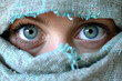 © Nelson - Closeup to surprised blu eyes in colored burka
