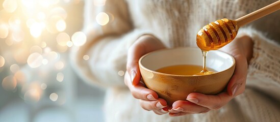 Aufkleber - Female hands holding a bowl of bee honey and a wooden spoon Close up Elaboration of organic soap based on glycerin. with copy space image. Place for adding text or design