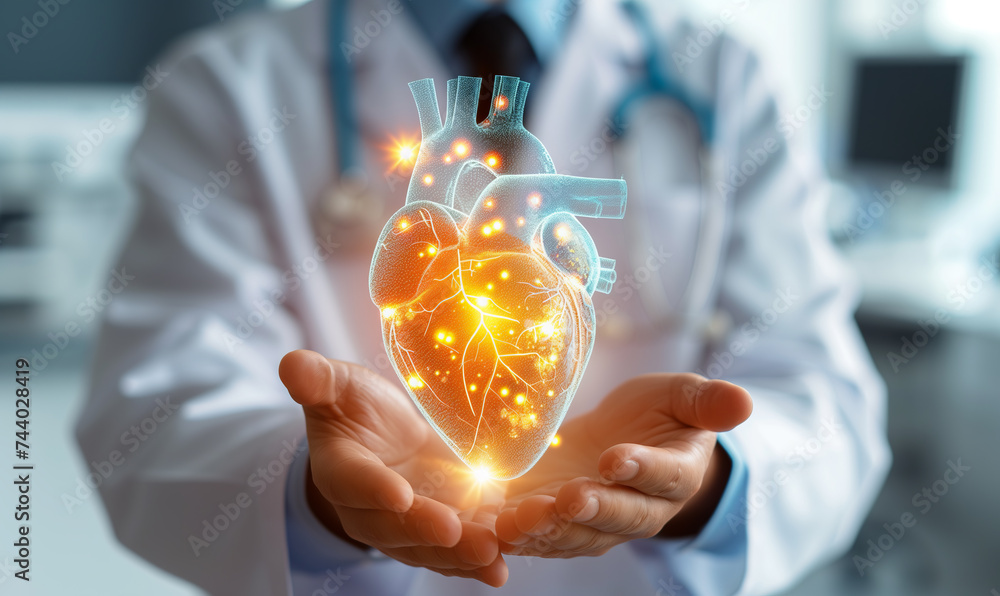 Medical doctor holding glowing virtual human heart in hands in cardio ...