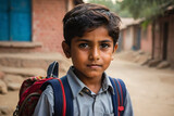 Fototapeta  - Portrait of 5 Year old boy student from Punjab Pakistan. Pakistani baby boy wearing school bag and ready to go to school. Education concept.Education in village of pakistan. Asian people from Pakistan