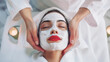 A serene woman enjoying a facial mask treatment at a spa, epitomizing relaxation and beauty care