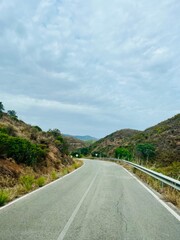 Wall Mural - Driving empty road in the mountains