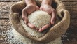 human hands holding handful of rice over burlap sack