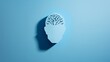 Brain placed inside of empty human head shape with shadow isolated on blue background