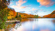 © Vincent Jiang - Lac-du-missionaire, Canada: Oct.10 2022: Morning fog on the lake of Lac-du-missionaire with colorful leaves in Quebec in a sunny autumn day