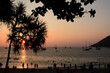 Sunset silhouettes at Nai Harn beach. Phuket. Thailand