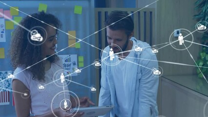 Canvas Print - Animation of network of connections with people icons over diverse business people with tablets