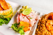 The close-up of ceviche, causa de papa, and seafood rice. Peruvian gastronomy. Marine trio