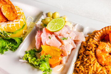 The close-up of ceviche, causa de papa, and seafood rice. Peruvian gastronomy. Marine trio