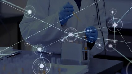 Wall Mural - Animation of network of connections over caucasian scientist taking sample