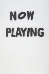 Poster - now playing sign (tracing paper on top of letters)