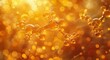 A shimmering bubble of amber and gold, illuminated by the warm glow of light, captures the intricate beauty of a molecule up close