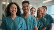 © Prasanth - Happy medical team, a group of student nurses and doctors, walk together with smiles on their faces in a teaching hospital. Diverse healthcare students starting their clinical training in scrubs.