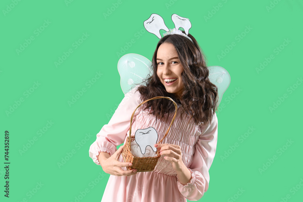 Tooth Fairy with basket on green background