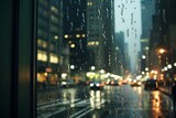 Fototapeta Na ścianę - a view of a city street through a window on a rainy day