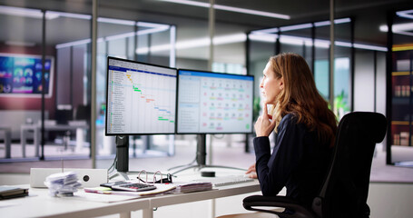 Poster - Employee Working On Calendar Schedule