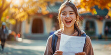 Excited happy Asian girl feels like a winner, happy about winning, gets a new job, female student gets good results in exam