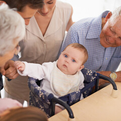 Wall Mural - Parents, grandparents and baby with portrait in home with bonding, security and healthy development. Family, men and women or infant in high chair with serious face, vulnerable and parenting in house