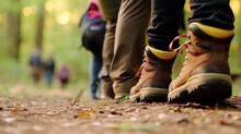 Shoes Of People Trekking In Wood And Walking In Row