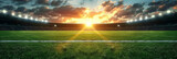 Fototapeta Sport - a soccer stadium at sunset,