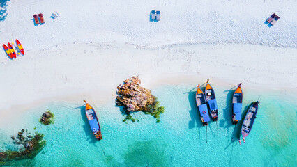 Wall Mural -  top view at longtail boats on the beach of Koh Lipe Island Thailand, tropical vacation background, colorful turqouse colored ocean drone view